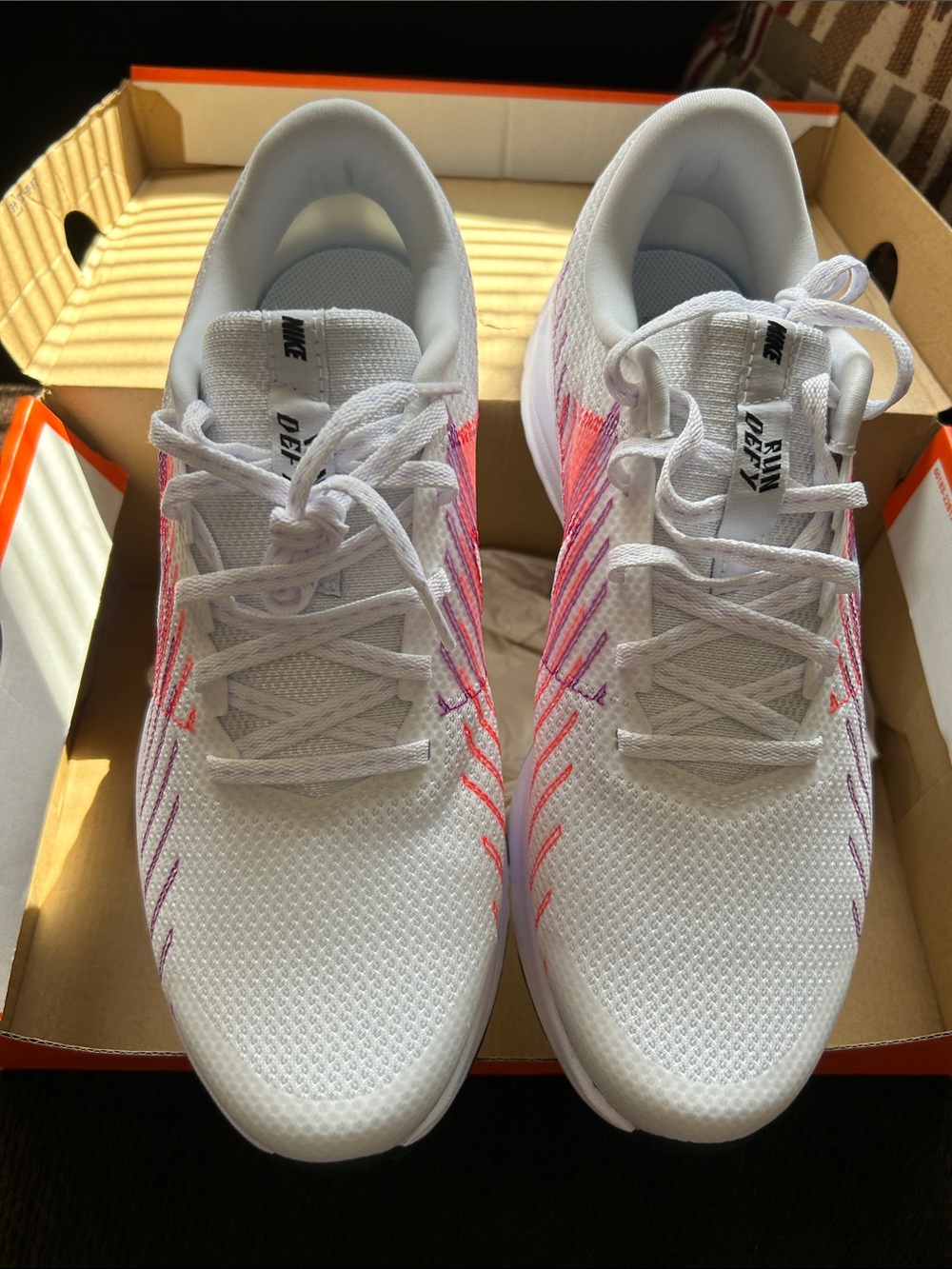 Nike Women’s White Athletic Sneakers with Pink Accents